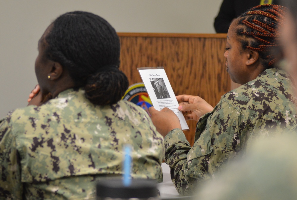 Sailors from Naval Medical Readiness Logistics Command receive a history presentation as part of African American History Month