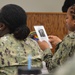 Sailors from Naval Medical Readiness Logistics Command receive a history presentation as part of African American History Month