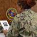 Sailors from Naval Medical Readiness Logistics Command receive a history presentation as part of African American History Month