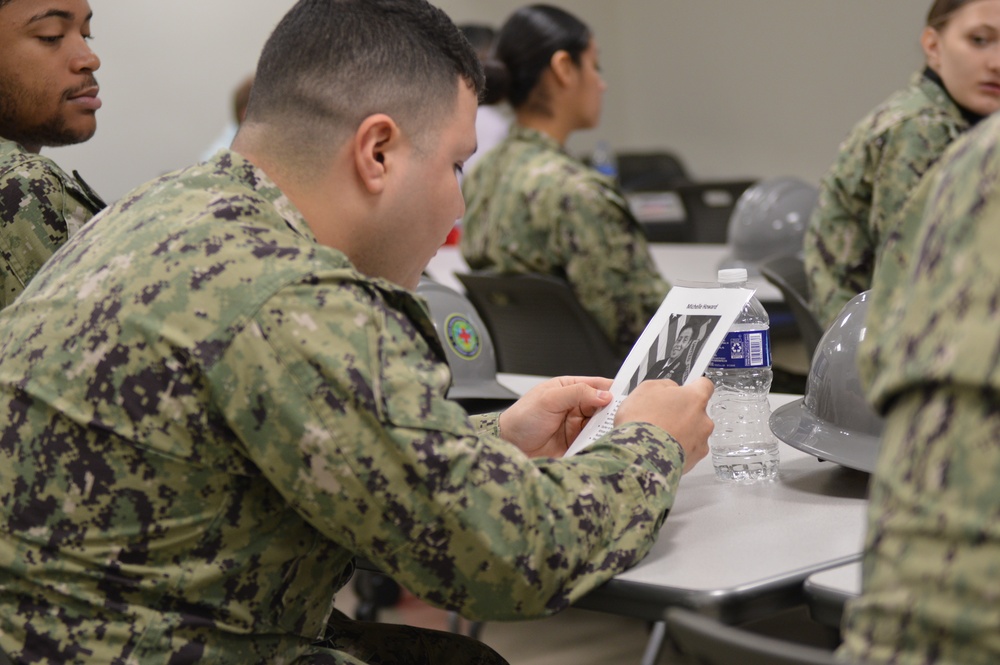 Sailors from Naval Medical Readiness Logistics Command receive a history presentation as part of African American History Month