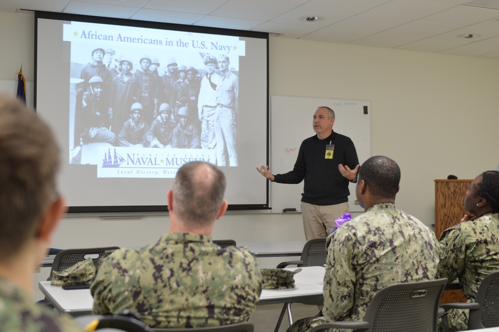 Sailors from Naval Medical Readiness Logistics Command receive a history presentation as part of African American History Month