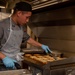 USS Carl Vinson (CVN70) sailor makes dinner in Wardroom 3