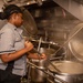 USS Carl Vinson (CVN70) sailor makes dinner in Wardroom 3