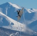 F-22 Raptors ascend above Alaska