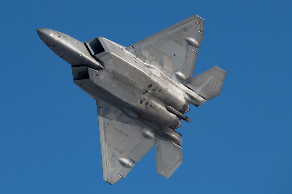 F-22 Raptors ascend above Alaska