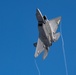 F-22 Raptors ascend above Alaska