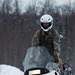 Arctic Warriors Riding Snow Machines