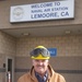 Stephen Beaton, NAVSUP FLC San Diego site Lemoore, stands proudly in front of the Naval Air Station Lemoore headquarters, in Lemoore, Calif., on Feb. 14.