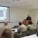 Naval Medical Readiness Logistics Command Sailors and Civilians receive a history presentation from Hampton Roads Naval Museum as part of African American History Month