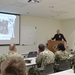 Naval Medical Readiness Logistics Command Sailors and Civilians receive a history presentation from Hampton Roads Naval Museum as part of African American History Month