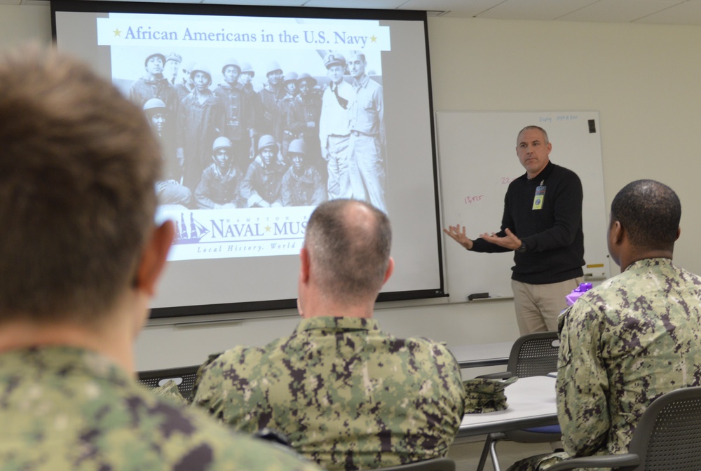 Naval Medical Readiness Logistics Command Sailors and Civilians receive a history presentation from Hampton Roads Naval Museum as part of African American History Month