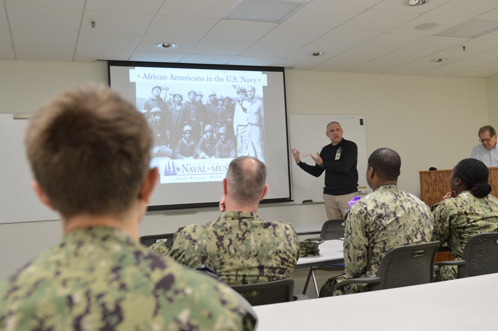 Naval Medical Readiness Logistics Command Sailors and Civilians receive a history presentation from Hampton Roads Naval Museum as part of African American History Month