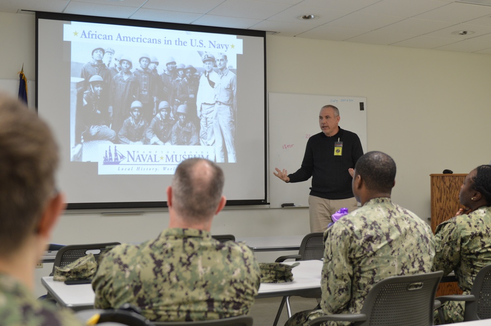 Naval Medical Readiness Logistics Command Sailors and Civilians receive a history presentation from Hampton Roads Naval Museum as part of African American History Month