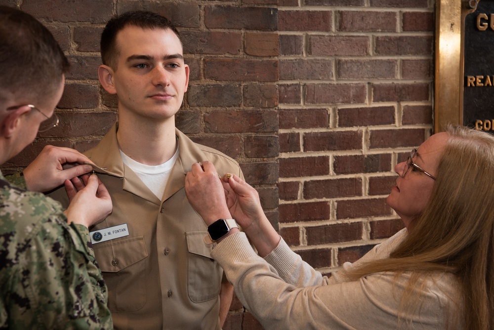 Musician 1st Class Jon Fontan is pinned upon arrival at U.S. Navy Band