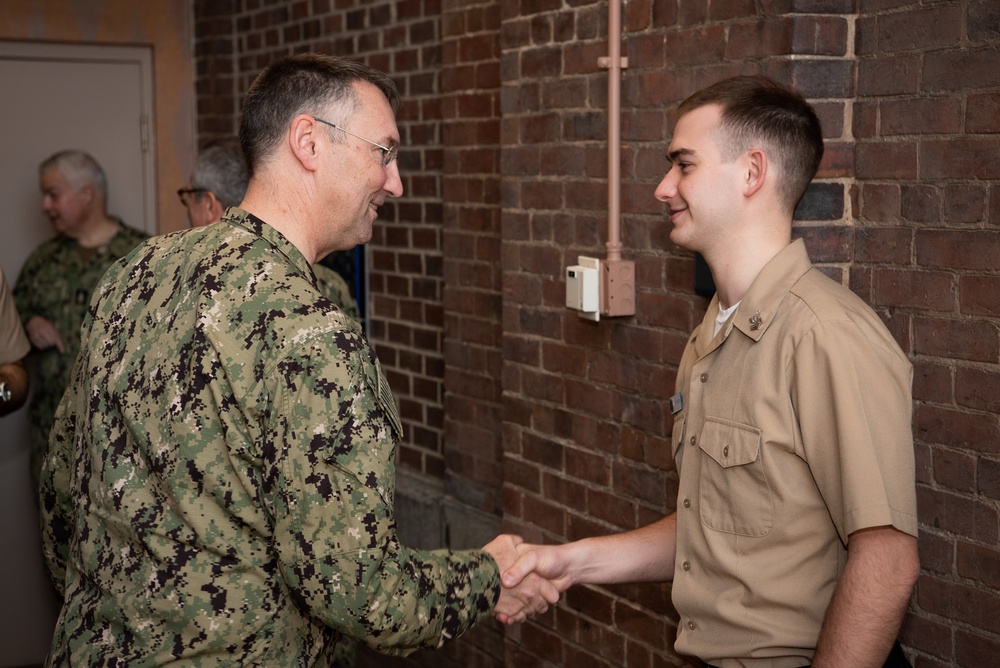 Musician 1st Class Jon Fontan is pinned upon arrival at U.S. Navy Band