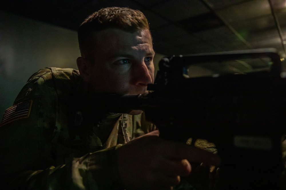 Sgt. Conner Williams fires a M4 simulation rifle