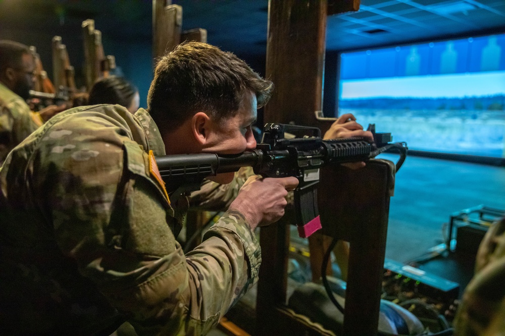 2nd Lt. Liam Spellissy fires a M4 simulation rifle