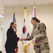 Department of the Army Civilian in Military Intelligence Brigade commissions as a Navy Officer