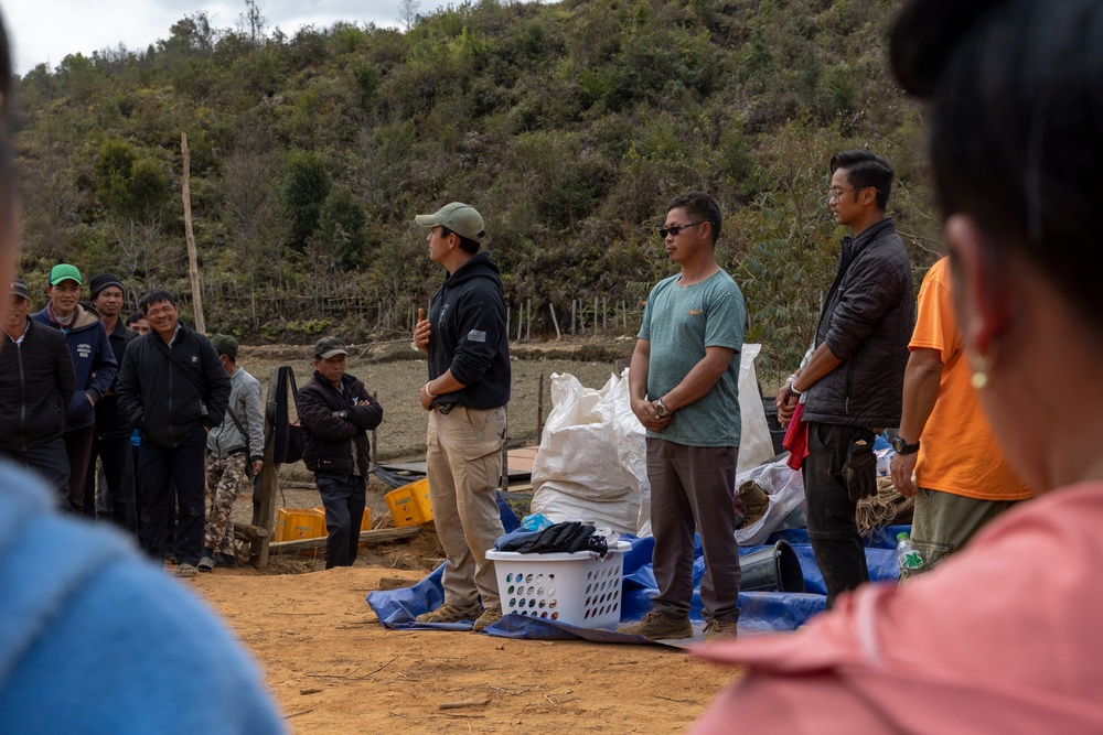 Recovery Team celebrate end of mission with local workers in Laos