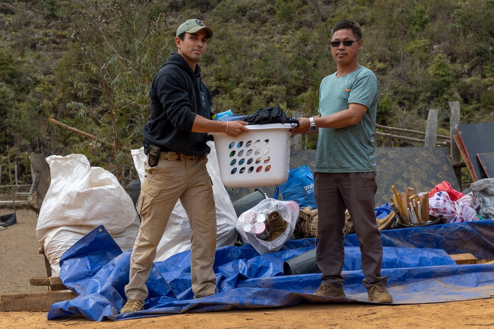 Recovery Team celebrate end of mission with local workers in Laos