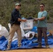 Recovery Team celebrate end of mission with local workers in Laos