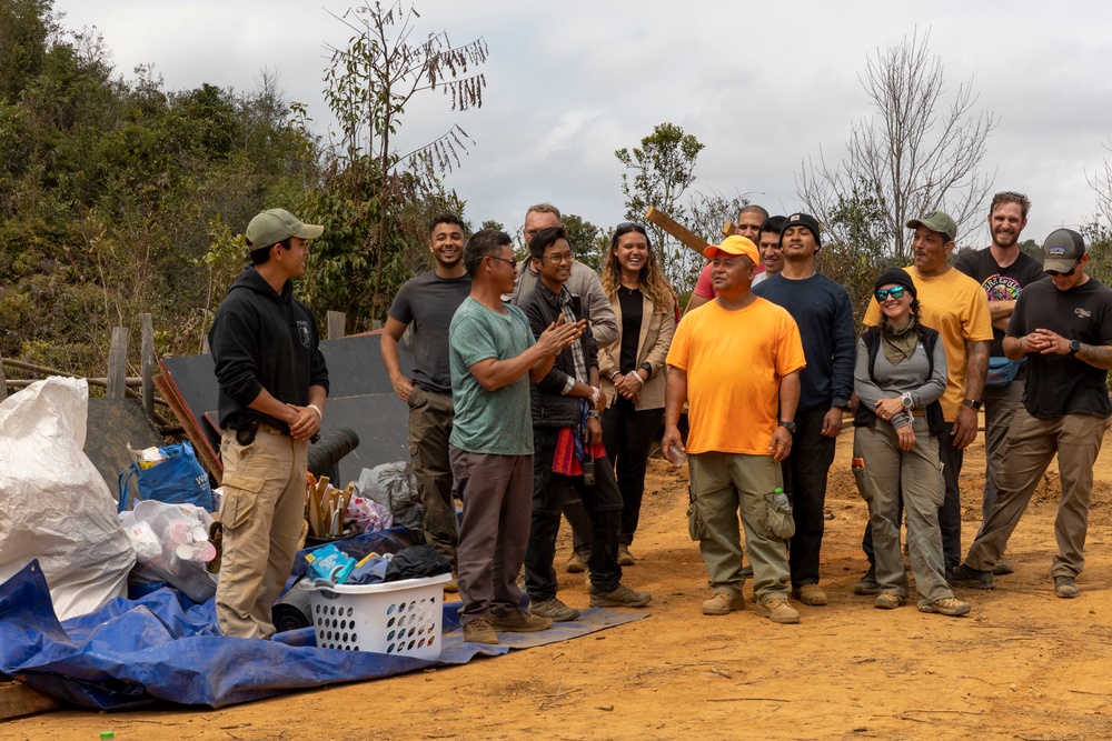 Recovery Team celebrate end of mission with local workers in Laos