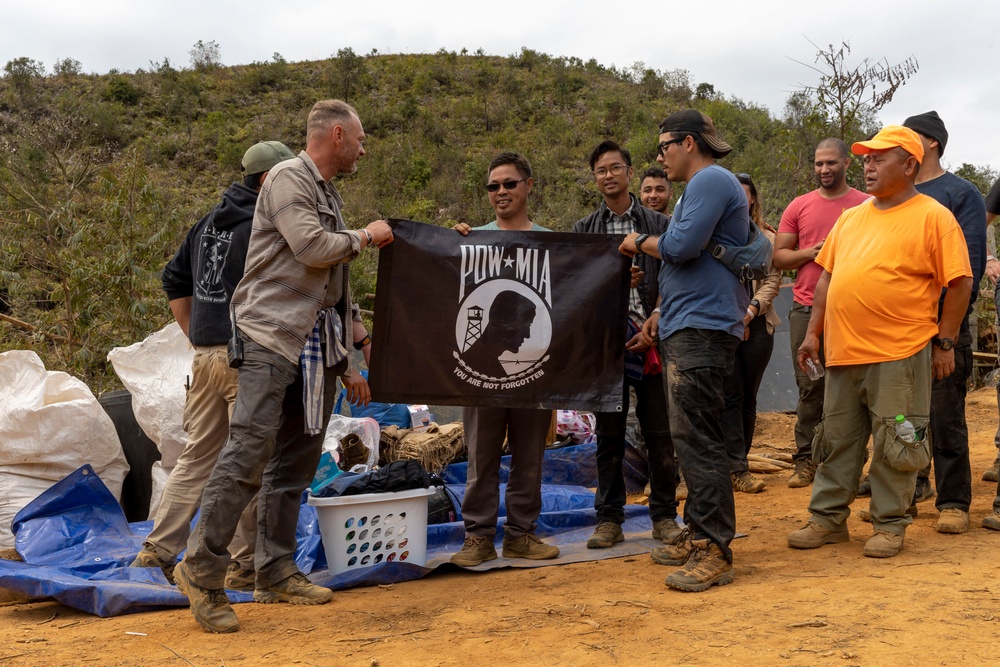 Recovery Team celebrate end of mission with local workers in Laos