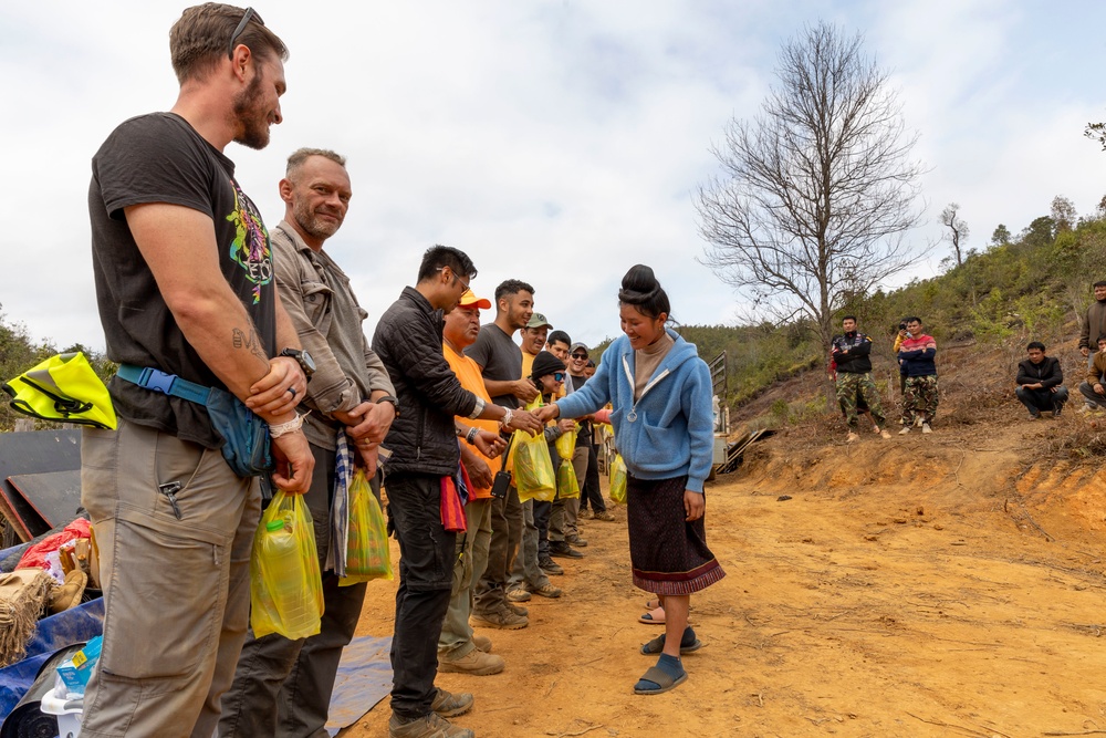 Recovery Team celebrate end of mission with local workers in Laos