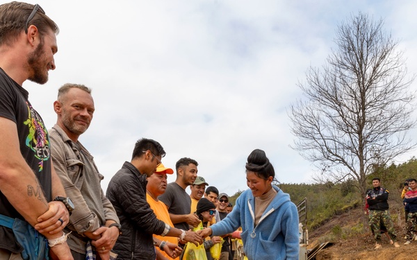 Recovery Team celebrate end of mission with local workers in Laos