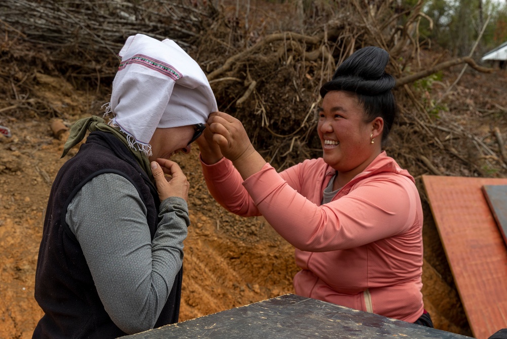Recovery Team celebrate end of mission with local workers in Laos