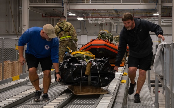 NASA alert crew, JB Charleston Airmen load rescue equipment onto C-17