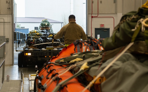 NASA alert crew, JB Charleston Airmen load rescue equipment onto C-17