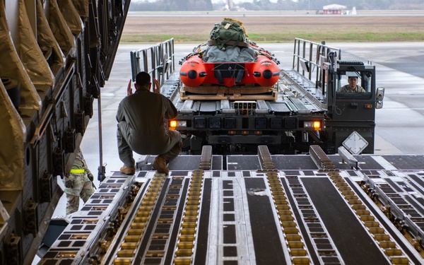NASA alert crew, JB Charleston Airmen load rescue equipment onto C-17