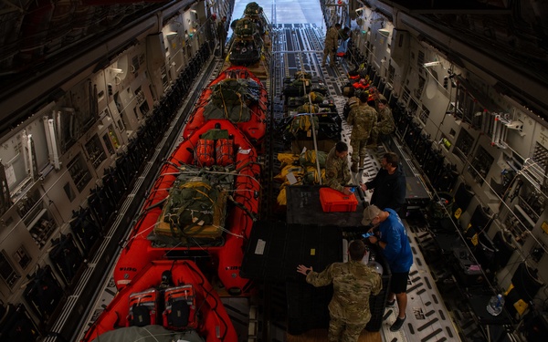 NASA alert crew, JB Charleston Airmen load rescue equipment onto C-17