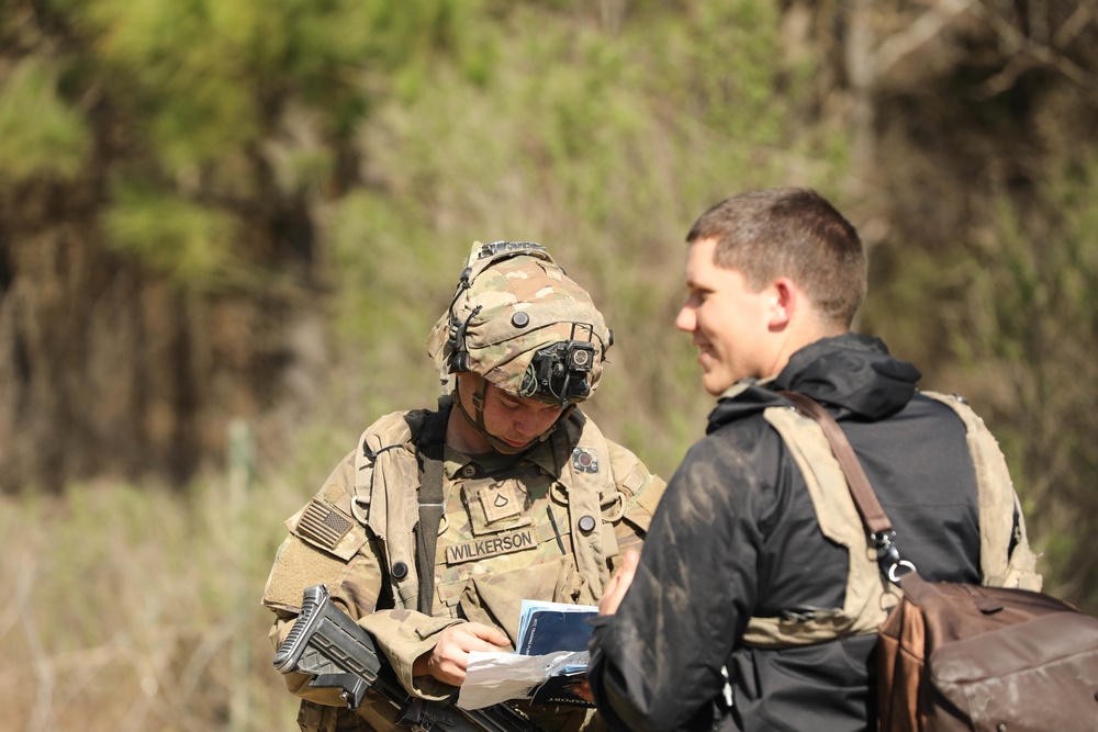 Soldiers with 2BCT of the 10th Mountain Division interact with role players serving as internally displaced people as part of the JRTC