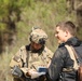 Soldiers with 2BCT of the 10th Mountain Division interact with role players serving as internally displaced people as part of the JRTC