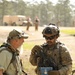 Soldiers with 2BCT of the 10th Mountain Division interact with role players serving as internally displaced people as part of the JRTC