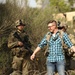 Soldiers with 2BCT of the 10th Mountain Division interact with role players serving as internally displaced people as part of the JRTC