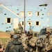 Soldiers with 2BCT of the 10th Mountain Division interact with role players serving as internally displaced people as part of the JRTC