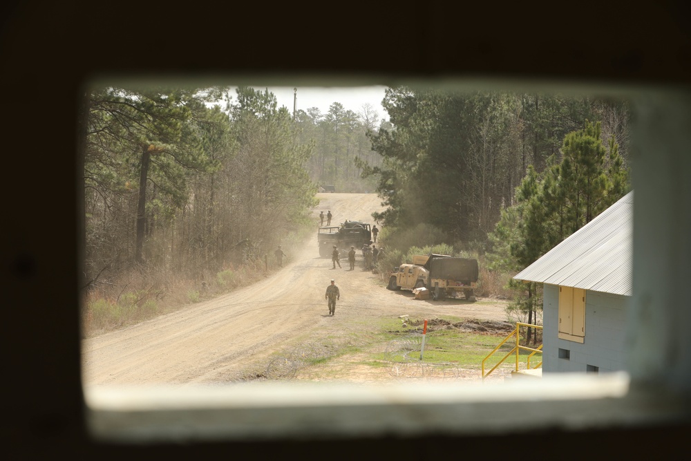 Soldiers with 2BCT of the 10th Mountain Division interact with role players serving as internally displaced people as part of the JRTC