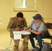 Soldiers with 2BCT of the 10th Mountain Division interact with role players serving as internally displaced people as part of the JRTC