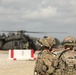 Soldiers with 2BCT of the 10th Mountain Division interact with role players serving as internally displaced people as part of the JRTC