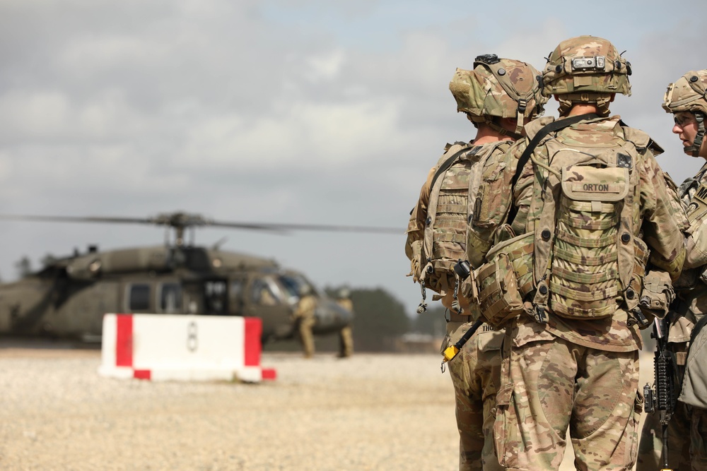 Soldiers with 2BCT of the 10th Mountain Division interact with role players serving as internally displaced people as part of the JRTC