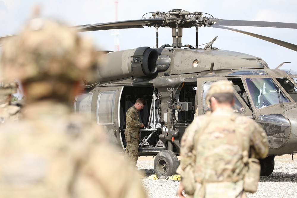 Soldiers with 2BCT of the 10th Mountain Division interact with role players serving as internally displaced people as part of the JRTC