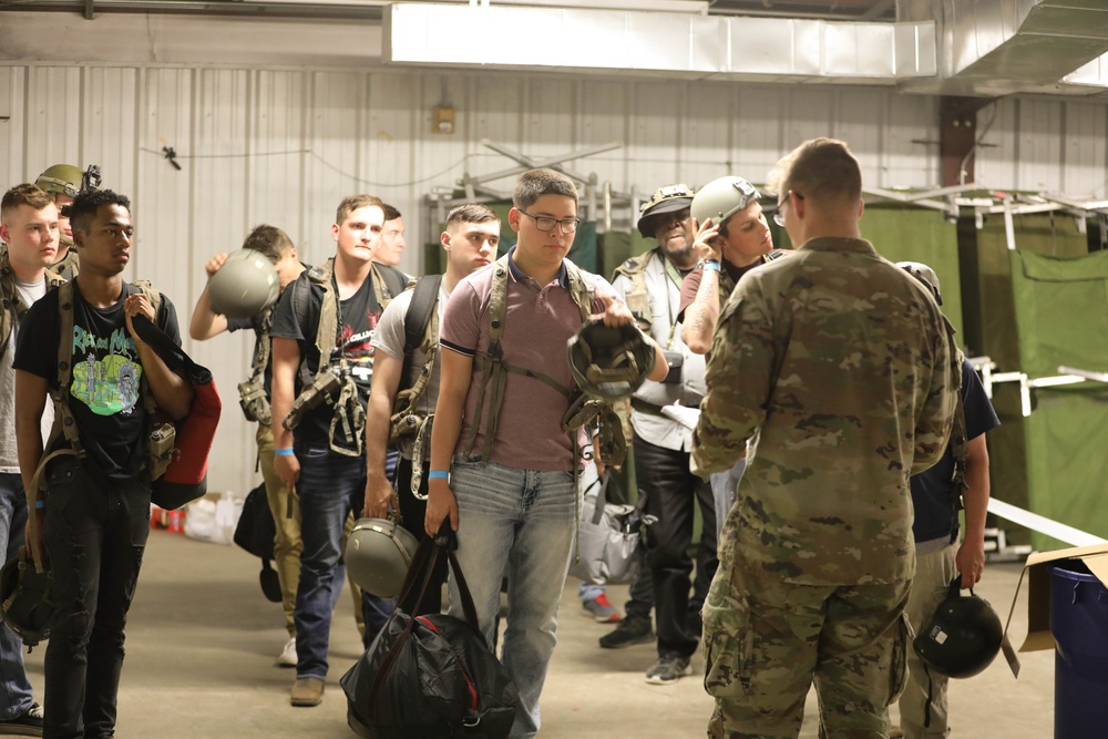 Soldiers with 2BCT of the 10th Mountain Division interact with role players serving as internally displaced people as part of the JRTC