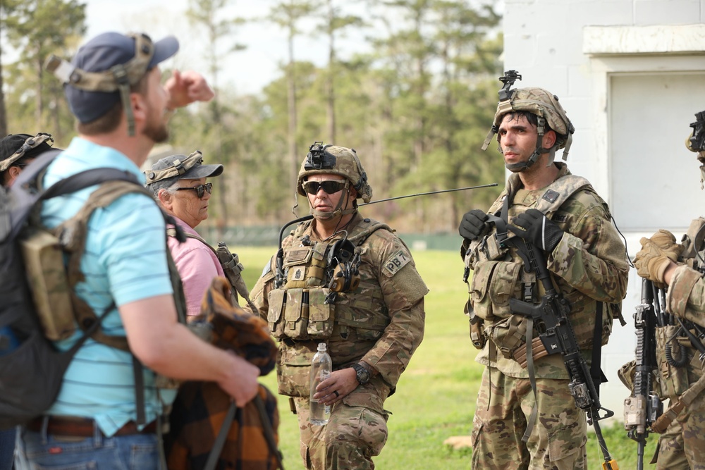 Soldiers with 2BCT of the 10th Mountain Division interact with role players serving as internally displaced people as part of the JRTC