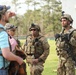 Soldiers with 2BCT of the 10th Mountain Division interact with role players serving as internally displaced people as part of the JRTC