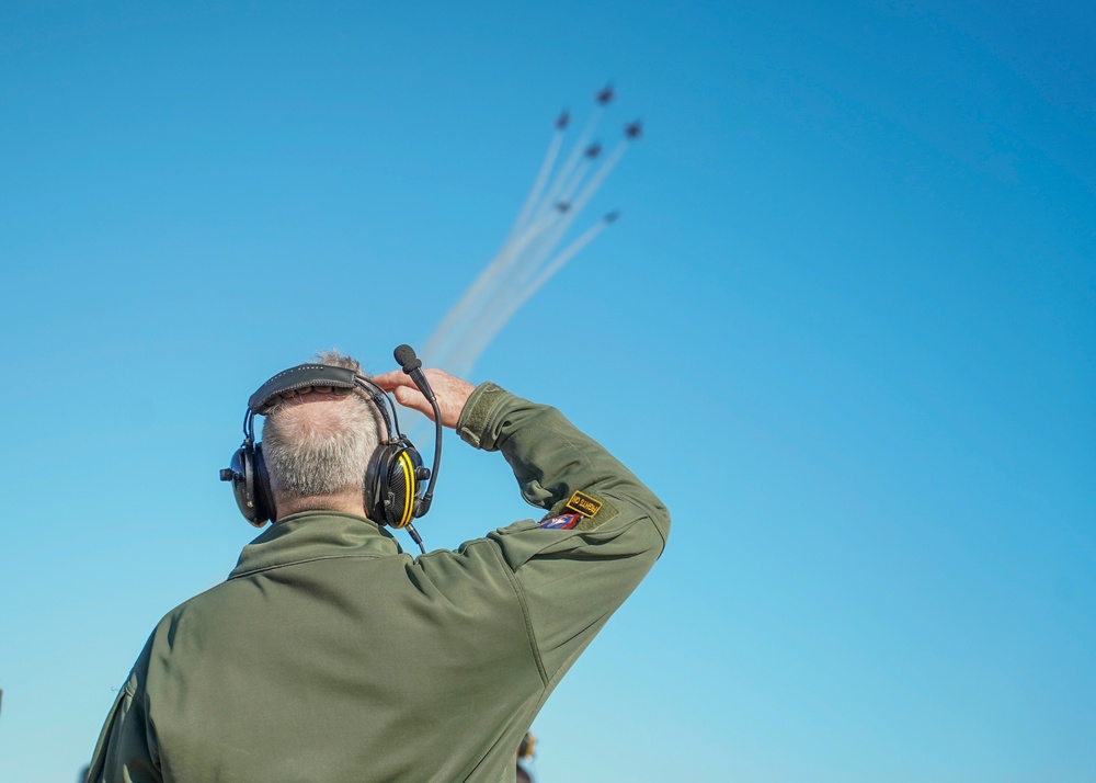 Chief of Naval Air Training, Rear Adm. Rich Brophy watches a Navy Flight Demonstration Squadron, The Blue Angels practice performance