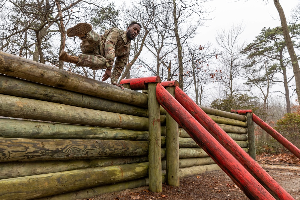 Sgt. Asuerus Thompson hurdles an obstacle