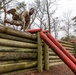 Sgt. Asuerus Thompson hurdles an obstacle